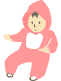 ピンクのカバーオールを着た赤ちゃんフリー素材